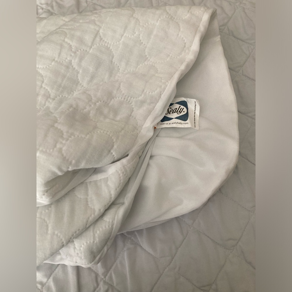 Sealy Total Stain Protection Waterproof Crib Mattress Pad.